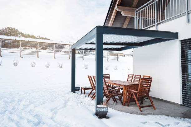 istock Hard top pergola protecting patio from snow 922566654
