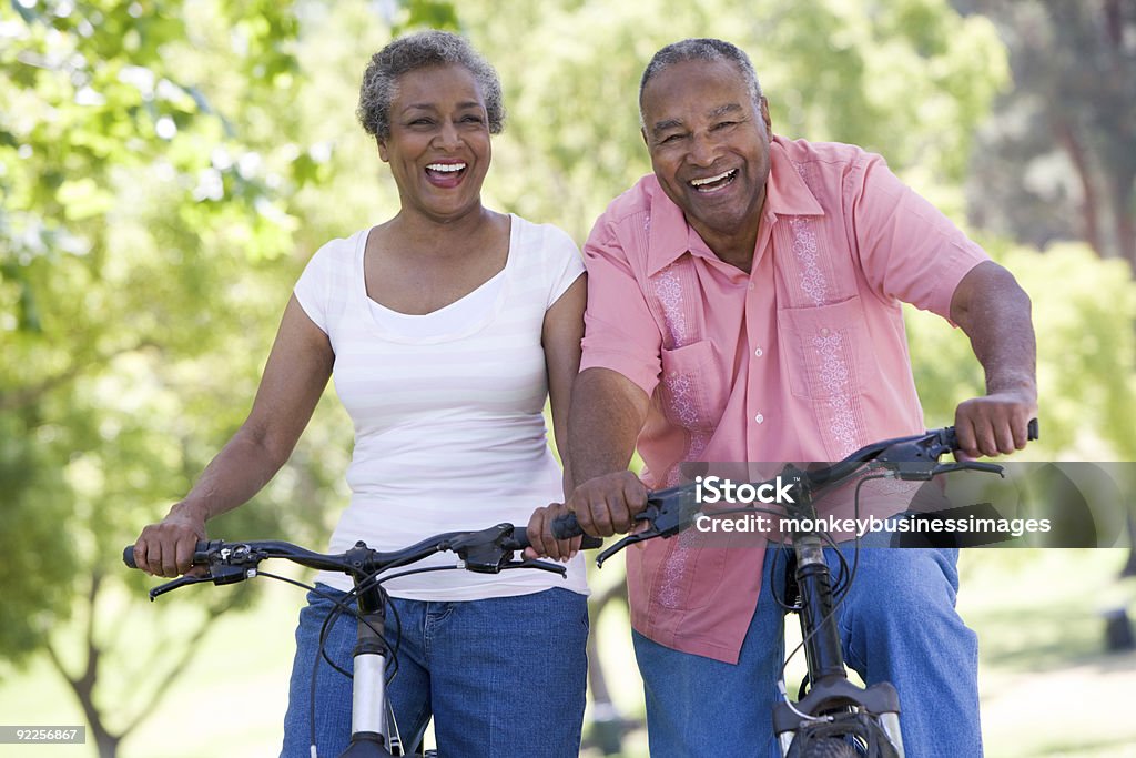 Senior couple on cycle ride Senior couple on cycle ride in countryside Senior Adult Stock Photo