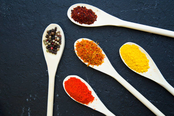 istock Set of specis and herbs on black stone background 922569866