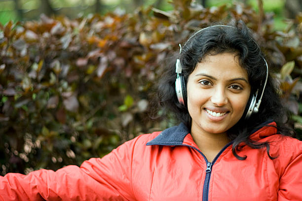 Listening Music  indian music stock pictures, royalty-free photos & images
