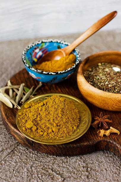 istock Different dry spices in bowls on a wooden Board on a concrete background 922574728
