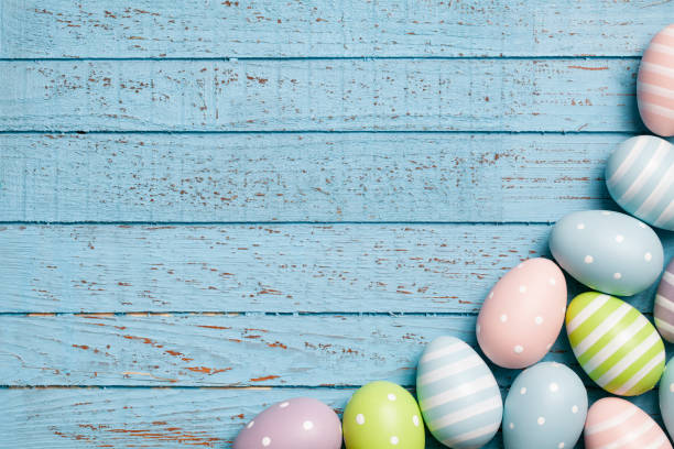 istock Easter eggs on blue old planks - Background Backdrop Decoration Wood 922574834