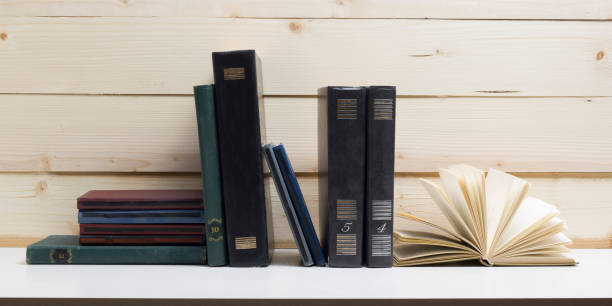 istock Open book, hardback books on wooden table. Back to school. Copy space 922575186