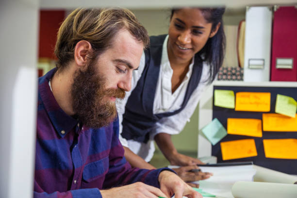 istock Co workers in the office - New Projects and business strategies 922575802