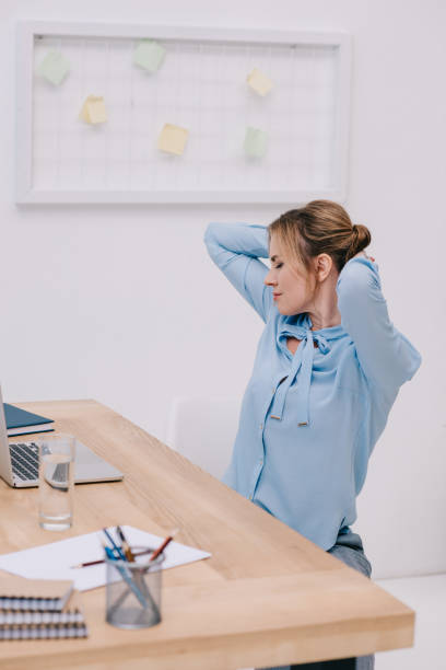 istock attractive businesswoman doing side twist at office 922578706