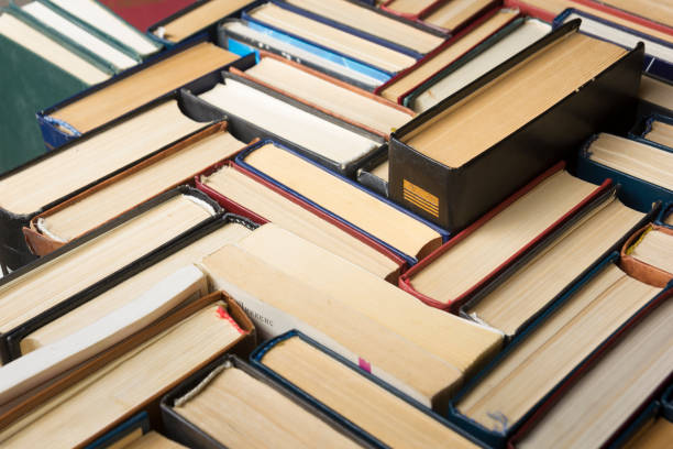 istock Stack of books background. many books piles. 922578764