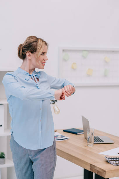 istock attractive businesswoman doing physical jerks at workplace 922579120