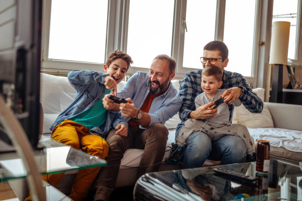 istock Parents with their children playing video games 922585748