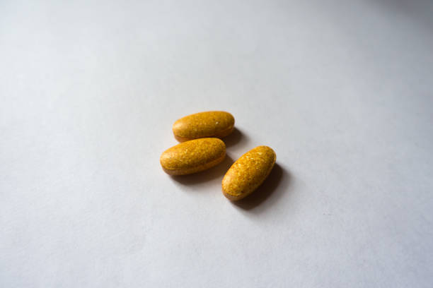 istock Big oblong tablets of multivitamins (three items) 922585786