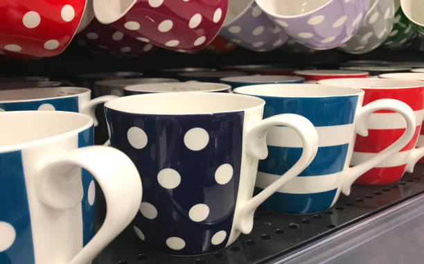 istock Colorful polka dot and stripe ceramic cups in dishware shop 922593870