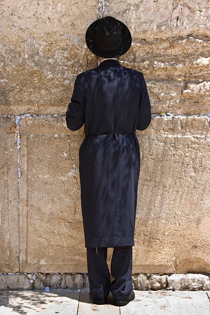 istock Man Praying at Western Wall in Jerusalem 92259564