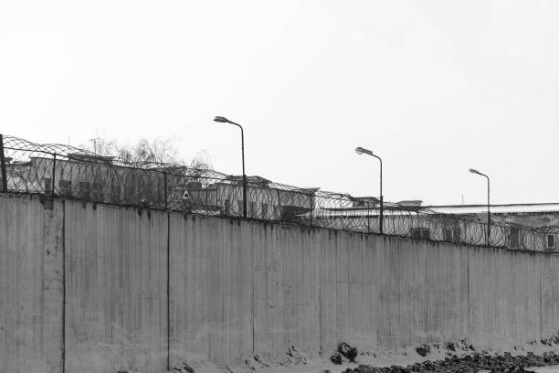 istock Fence with barbed wire, place of detention 922604338