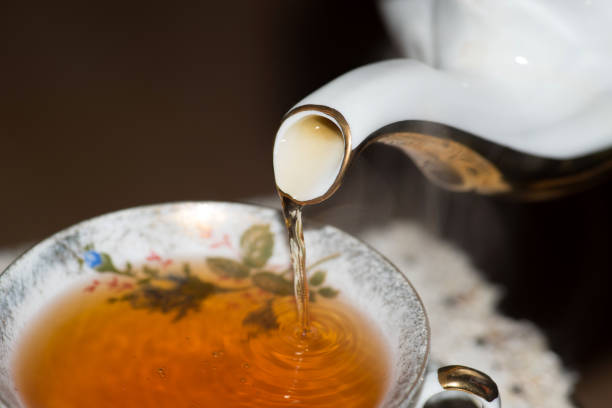 istock Tea in a porcelain cup and a jug 922606780