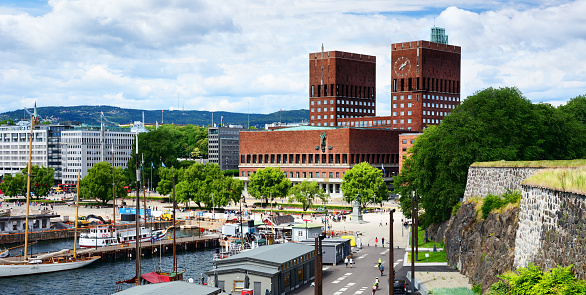 Tourists and locals around the Oslo City Hall in summer time, Norway