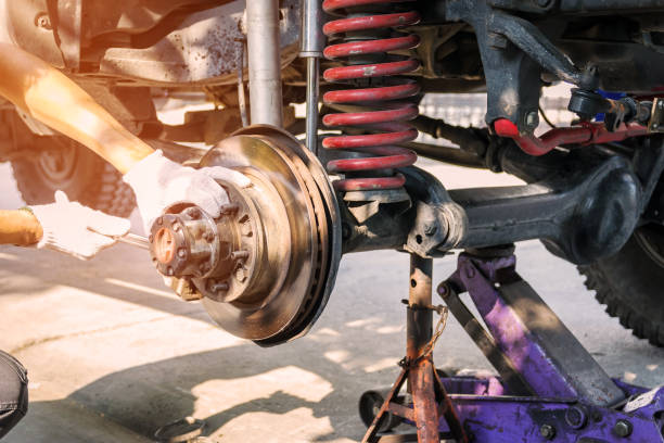 car service industry The front wheel of the car was removed to repair the brake system, Automotive industry and garage concepts. broken spring stock pictures, royalty-free photos & images