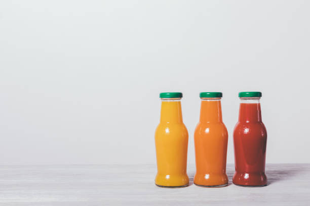 istock Three bottles of fruit juices 922607756