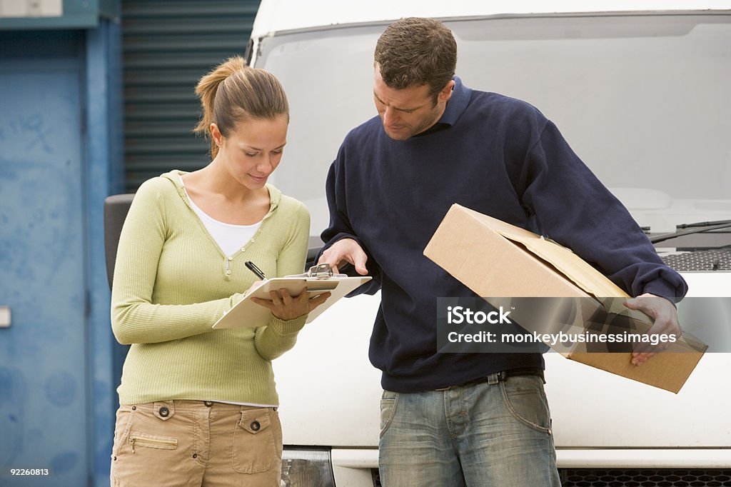 Man delivering parcel  20-29 Years Stock Photo