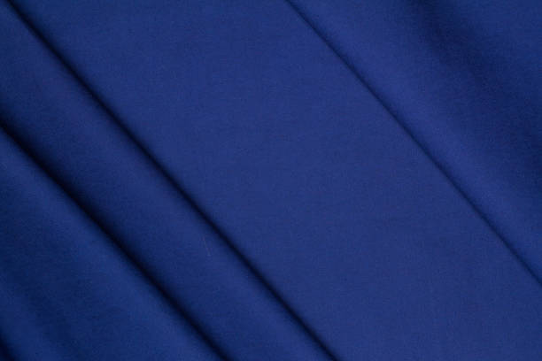 istock Blue woolen crumpled wrinkled fabric with waves 922610956