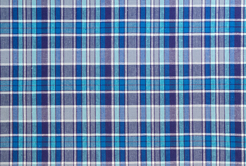 Flannel, cotton into the classic scottish cell as textile background in vintage style \