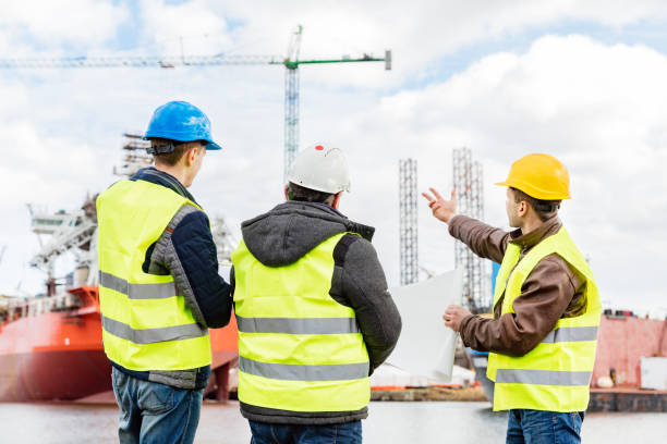istock Senior engineer builders at the construction site. Ship building industry. 922611962