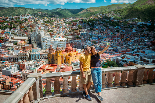 Couple visiting Guanajuato from lookout on the mountain. Mexico