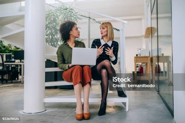 Coming Up With Solution Together Stock Photo - Download Image Now - Two People, Advice, Laptop