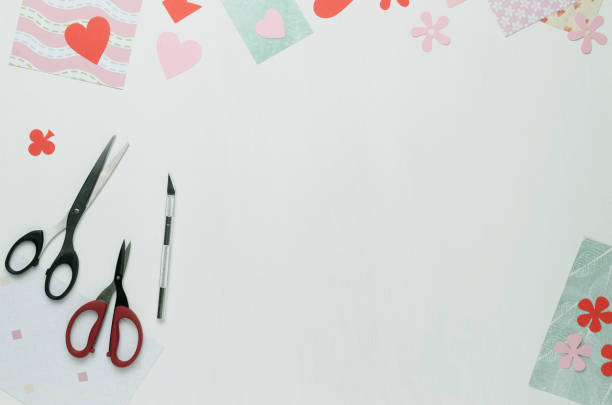 istock Sheets of multi-colored paper, scissors, scalpel and paper figures 922623810