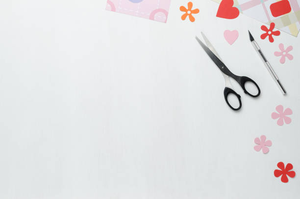istock Multicolored sheets, scalpel, scissors and paper figures 922623894