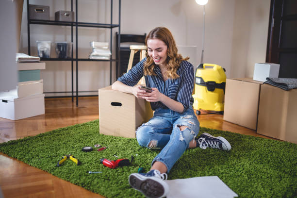 istock Happy smiling girl texting on her phone 922623954