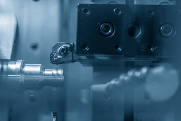 istock CNC lathe machine cutting the metal  screw 922624644