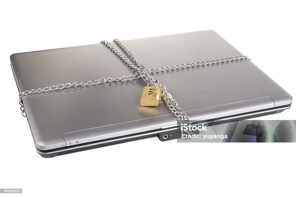 Laptop with lock and chain  Backgrounds Stock Photo