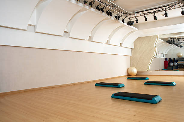 istock Health club aerobics studio featuring steps 92263162