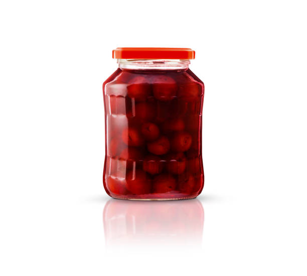 istock Cherry compote in a glass jar. Isolated on white background 922633262