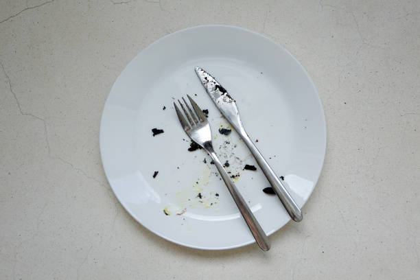 istock Dirty dish with knife and fork on background 922633272