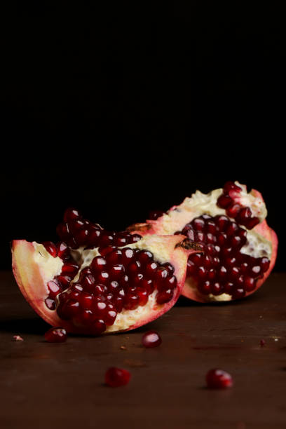 istock Pomegranate pieces on the table, pomegranate still life 922635894