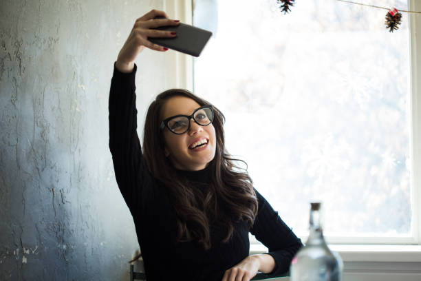 istock Young woman taking a selfie at the cafe 922635956