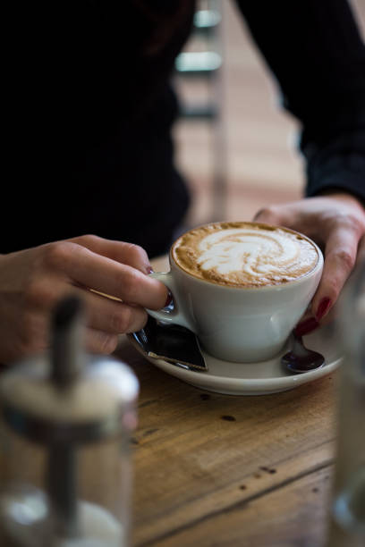 istock Women holding a cup of hot latte 922636446
