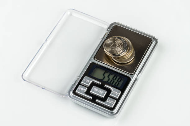 istock digital jewellery scales with coins 922636586