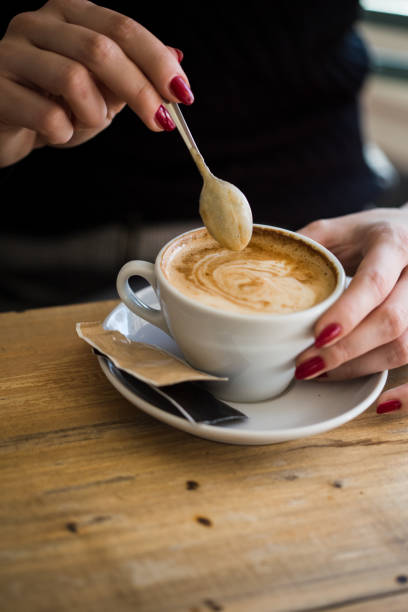 istock Women holding a cup of hot latte 922637402