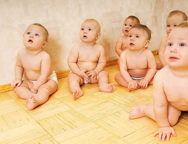 istock Group of adorable toddlers sitting on a floor 92263949