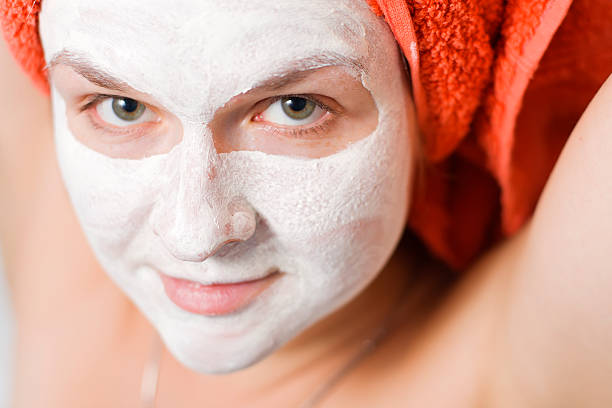 woman with face pack stock photo