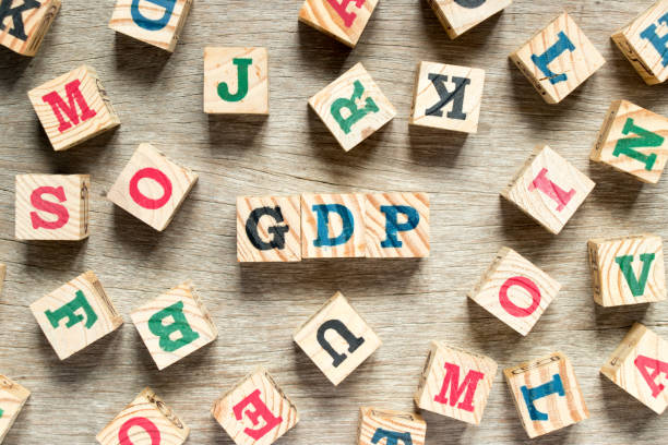 istock Letter block in word GDP with another on wood background 922645712