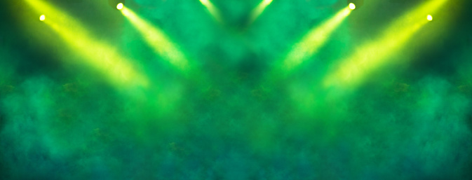 Stage light projector and yellow glitter lights on green background. Abstract Spotlight Glitter lights background.