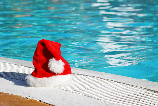 istock Santa Claus hat on the ground by a pool 92264667