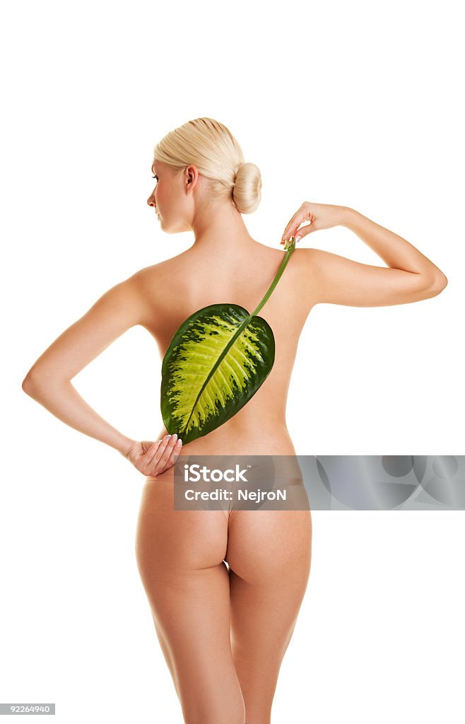 Bela jovem mulher com folha verde exótica. Isolado a branco - Royalty-free Adulto Foto de stock