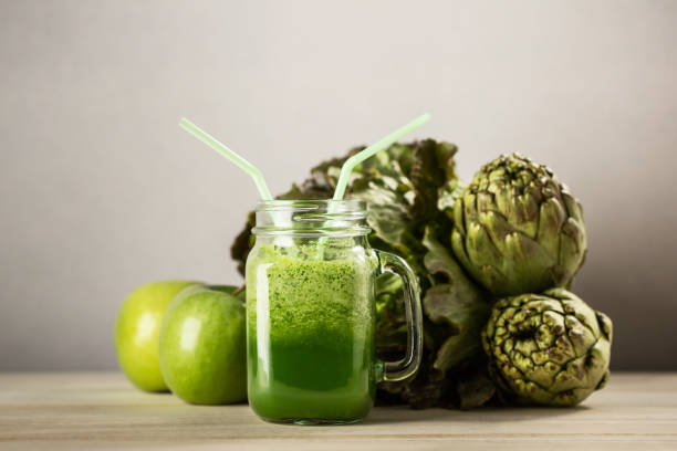 Green detox juice glass stock photo