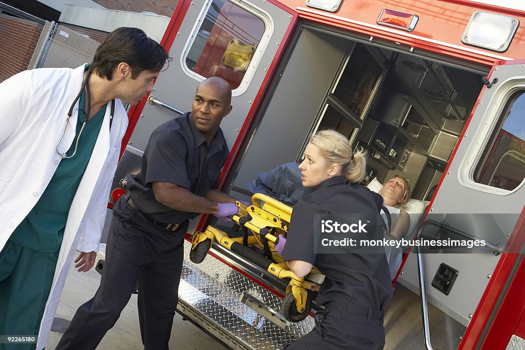 Paramedics unloading patient from ambulance  Ambulance Stock Photo