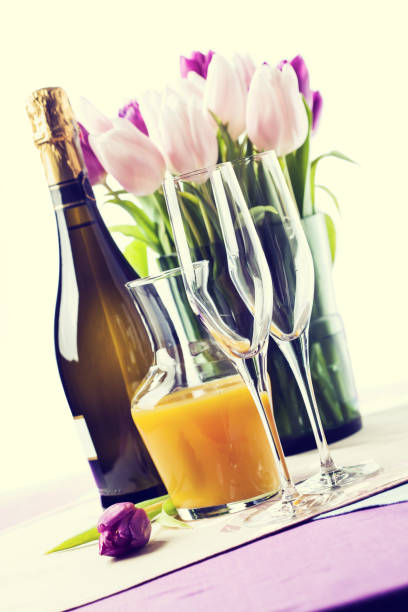 istock Two empty champagne flutes and a bottle of sparkling wine 922653980