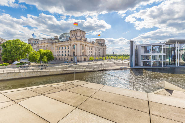 Berlin government district with Reichstag and Spree river in summer, Germany Panoramic view of Berlin government district with Spree river passing famous Reichstag building and Paul Lobe Haus on a beautiful sunny day with blue sky and clouds, central Berlin Mitte, Germany the reichstag stock pictures, royalty-free photos & images