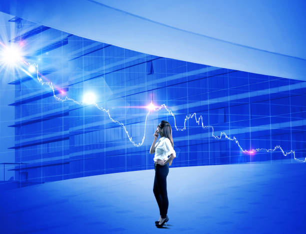 istock Businesswoman looking at bar graph on modern office window 922657918